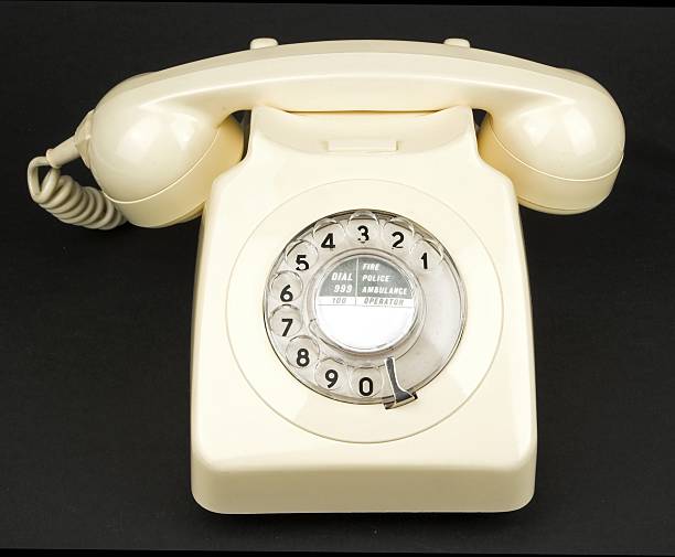 istock White Or Ivory Vintage Dial Telephone On Black Background 92403653