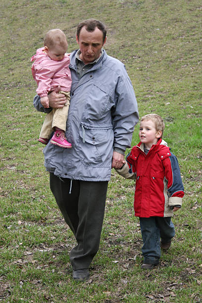 istock grandfather with grandchildren 92403801