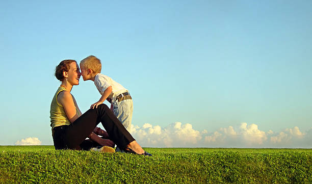 istock mother with son on sundown kiss by nose 92403814