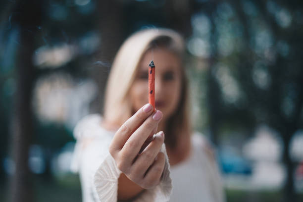 Girl Holding Joint Stock Photo - Download Image Now - Cannabis Plant, Smoking - Activity, Cannabis - Narcotic - iStock Girl Holding Joint Stock Photo - Download Image Now - Cannabis Plant, Smoking - Activity, Cannabis - Narcotic - iStock
