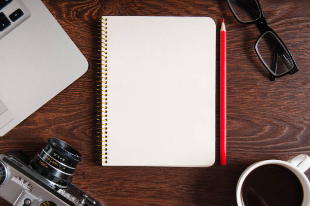 istock High angle view of notepad with copy space. Table with laptop and supplies. Top view. Flat lay. Freelancer or student desk 924045184
