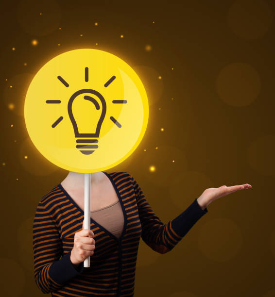 istock Woman holding lightbulb sign 924045756