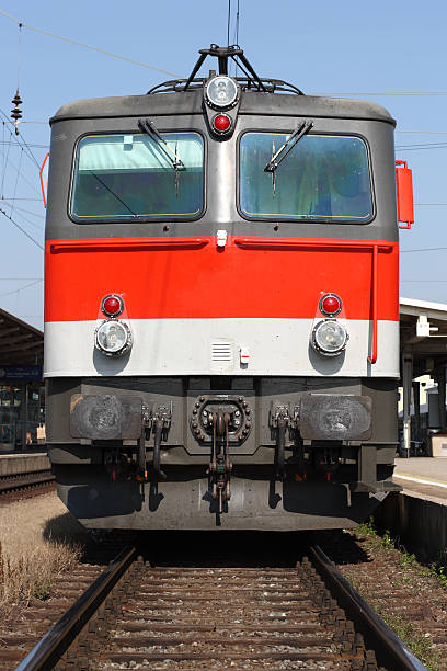 Braunschweig, Germany, June 15., 2019: Red historic electric locomotive of the company Bombardier with the emblem of the German railway stands on the sidetrack