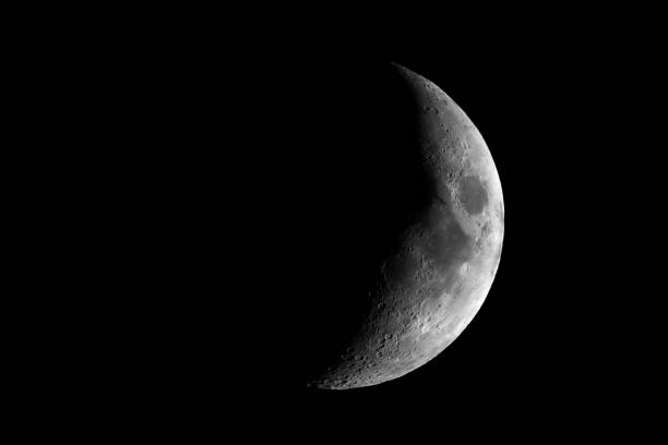 istock High contrast Waxing crescent moon seen with telescope 924048844