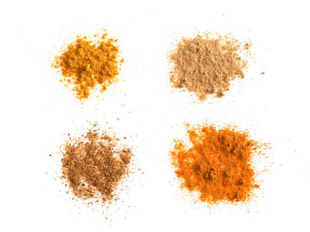 istock many spices including Ginger Curry Turmeric and Chili Pepper over white 924049074