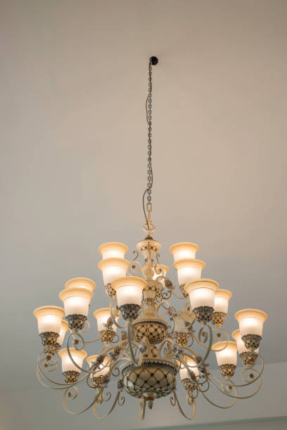 istock Vintage chandelier light bulb in dark room 924049240
