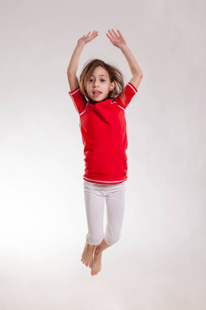 istock Little girl jumping 924049620