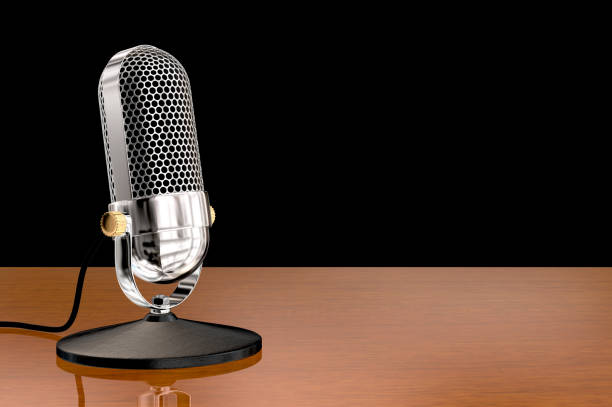 istock Chrome vintage microphone on table top stand 924055180