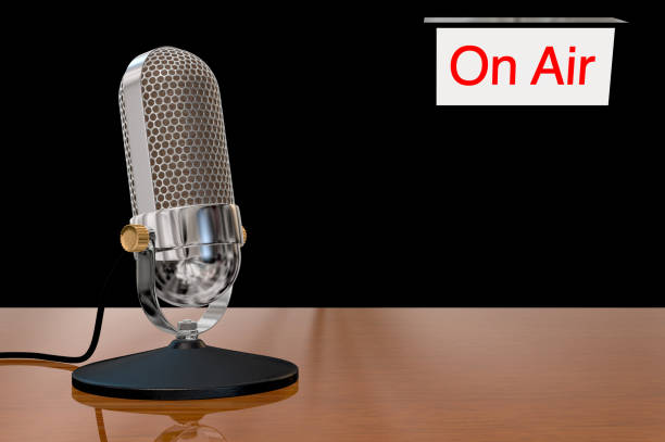 istock Chrome vintage microphone on table top stand with on air sign 924055194