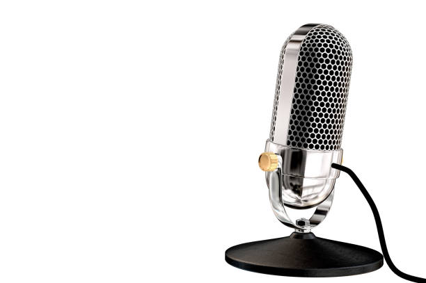 istock Rear view of a chrome vintage microphone on table top stand 924055330