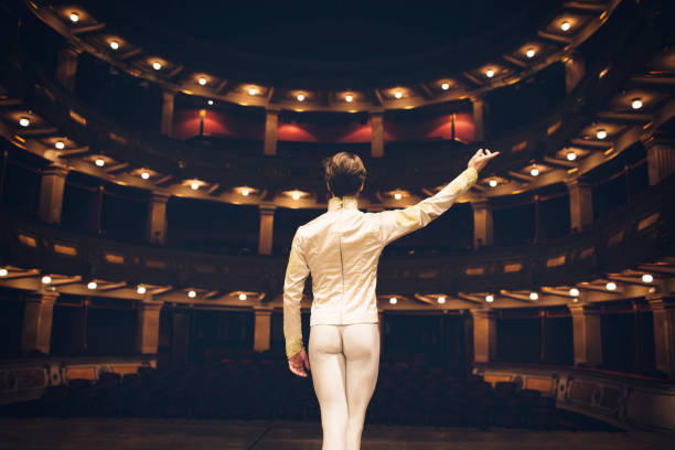 Male Ballet Dancer Male ballet dancer on rehearsal at stage theatre. performer stock pictures, royalty-free photos & images