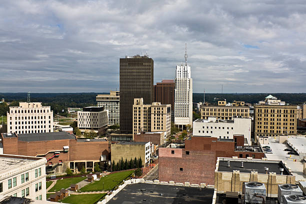 A skyline view of downtown buildings in Akron, Ohio Akron, Ohio - downtown buildings seen during cloudy day. akron ohio stock pictures, royalty-free photos & images