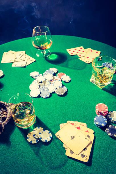 istock Closeup of gambling green table with chips and cards 924058002