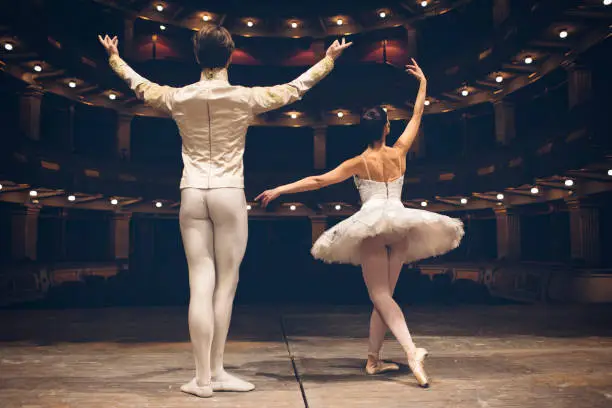 Ballet dancers on the theatre scene on rehearsal.