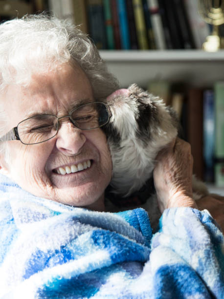 istock Happy Senior Woman with pet dog 924059310