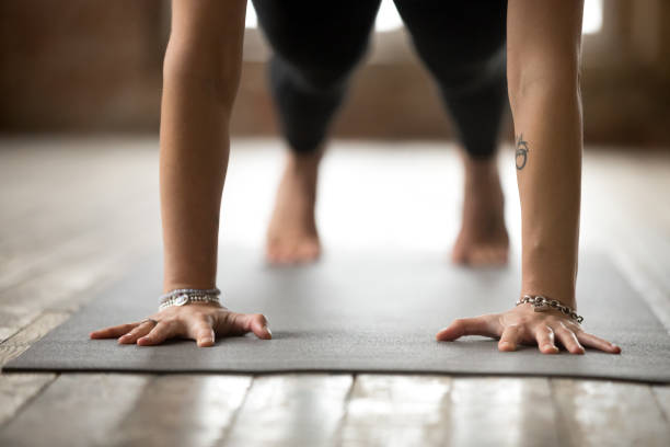 istock Woman doing Push ups or press ups exercise, closeup 924059536