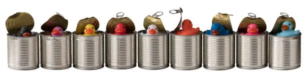 Photo of Multi colored generic rubber ducks emerging from a row of opened tin cans.