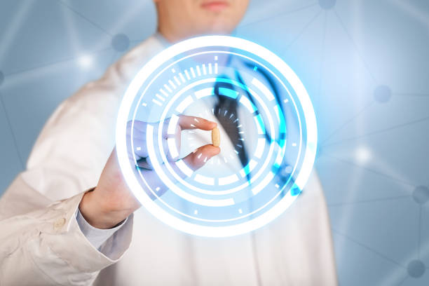 istock Male doctor holding a pill with glowing circles 924062416