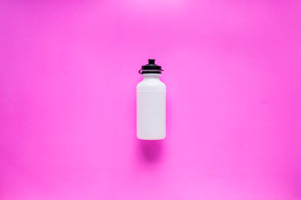 Sports bottle on pink background