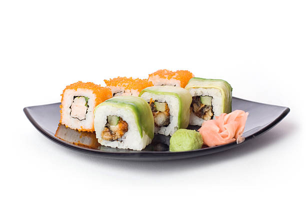 Maki-sushi on black plate stock photo
