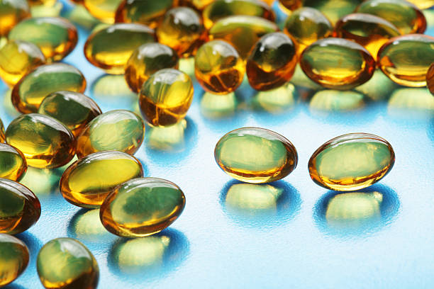 istock Fish oil pills that have been poured from the bottle 92406745
