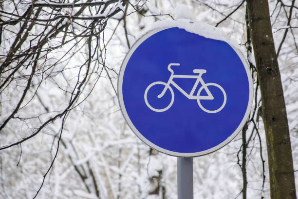 istock round bicycle lane sign against tree branches 924068172