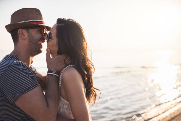 istock Love Couple Smiling and Embracing by Sea 924069792