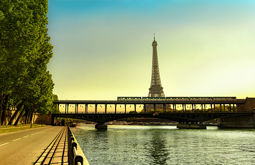 Magnificent Sunrise with the Eiffel Tower and metro train on Bir Hakeim bridge