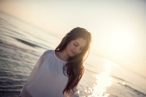 istock Young woman enjoying on the beach 924072744
