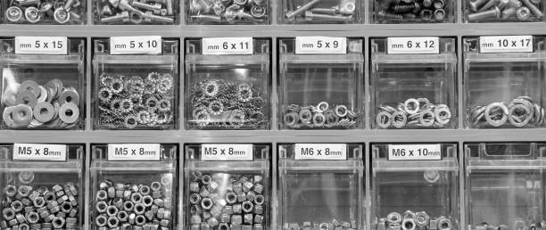 Red boxes with asorted nails, pins, screws and more.