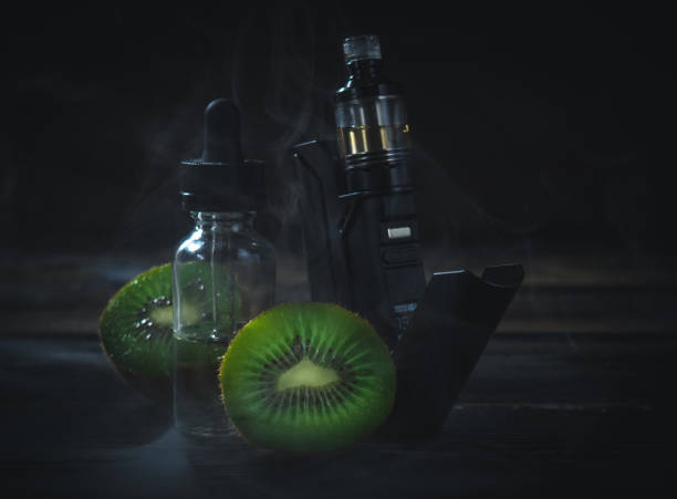 istock black vaporizer in the smoke with sliced kiwi 924076548