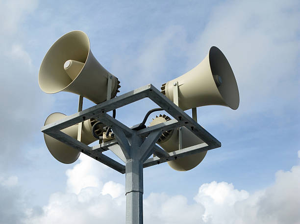 istock Loudspeakers against blue sky 92407724