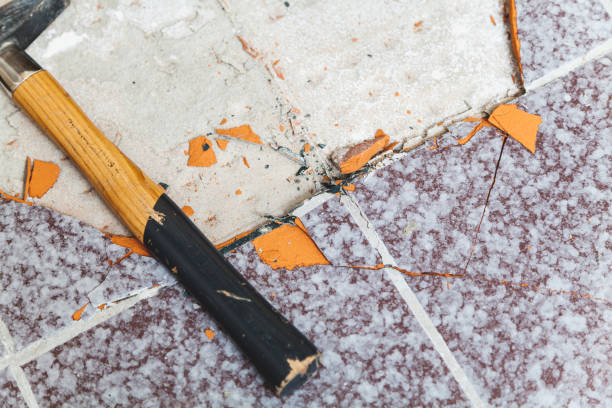 istock hammer lies on the floor without tiles 924080704