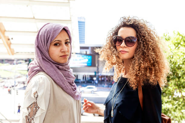 istock two beautiful girls with shopping bags 924083232