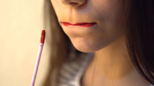 istock Young beautiful female applying her make-up 924083244
