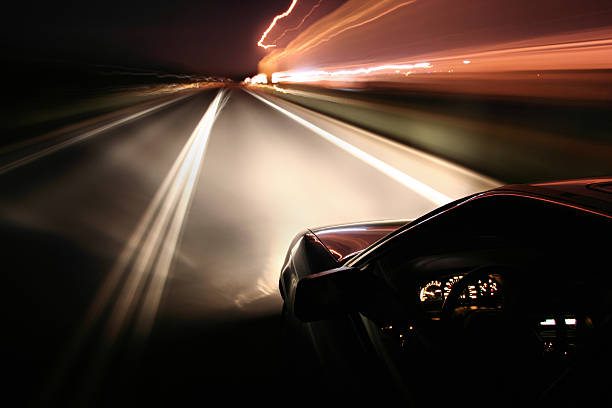 Driving at night stock photo