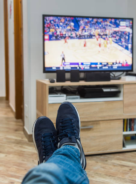 istock man watching a basketball game on tv 924083538