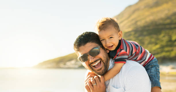 istock Father and son having fun and enjoying spending time together outdoors 924083778