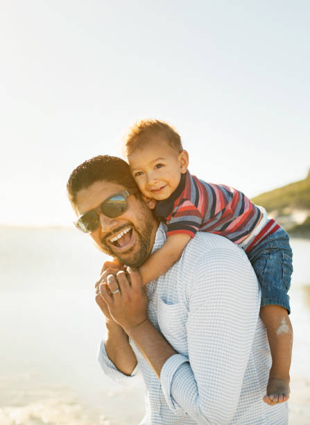 istock Father and son having fun and enjoying spending time together outdoors 924083784