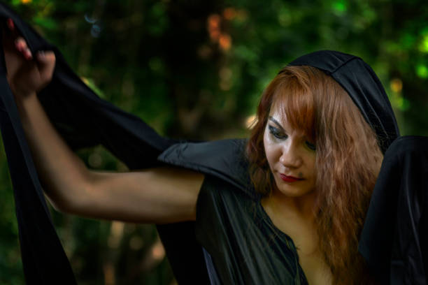 istock young witch from legends and fairy tales performs a sorcerous rite in the forest. 924083786