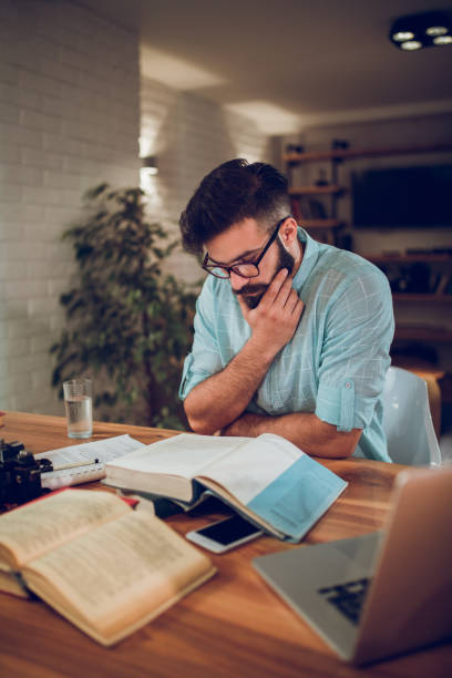 istock Young male student studying for the exams at home 924084880