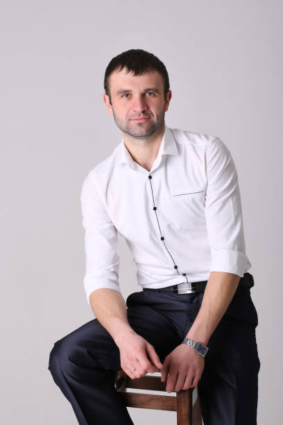istock Confident businessman. Young handsome man in shirt standing on white background. 924085212