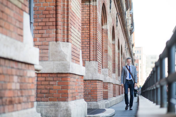 istock Mature businessman walking in a city. 924087322