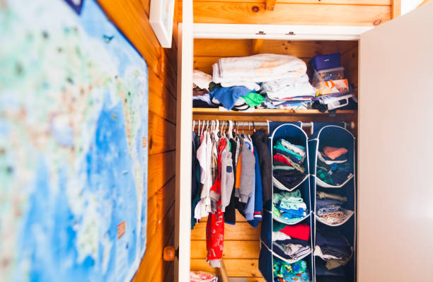 istock Clothing rack in kids room. 924087890