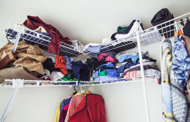 istock Messy clothing rack in house. 924087926