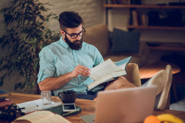 istock Young male student studying for the exams at home 924088124