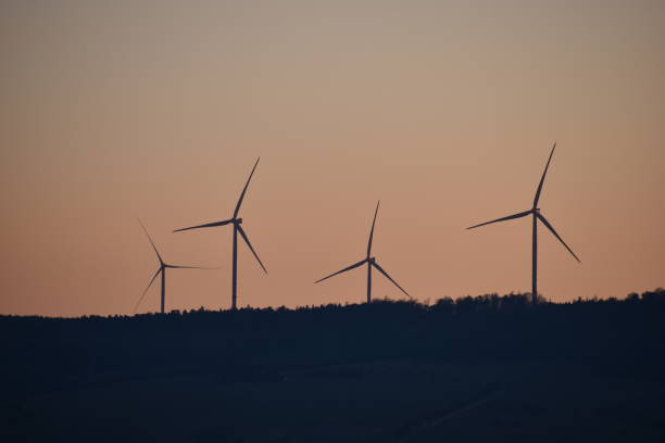 istock Wind turbines in the sunset on a meadow in Kassel, Germany 924091170