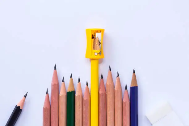 pencil-sharpener, eraser, and many pencils isolated on white paper background. with copy space for your text."n
