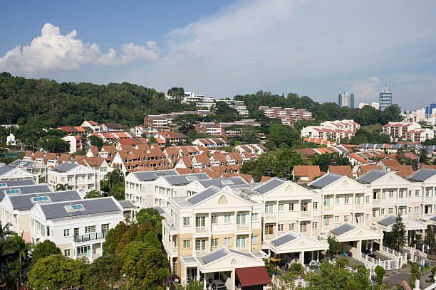 Street scene with historical homes in Singapore's Geylang district. The homes are very colorful and traditional.