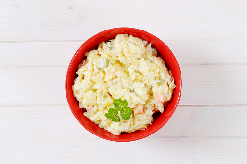 bowl of potato salad on white background